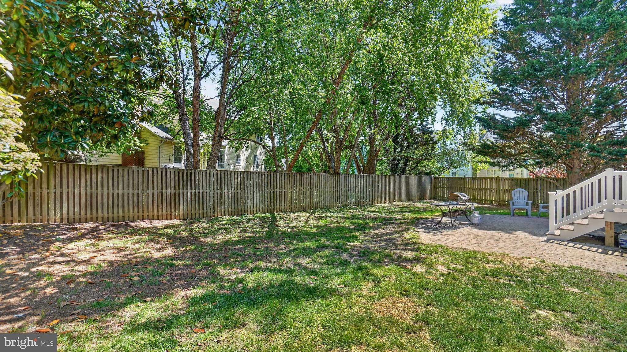 2812 Brite Court Crofton, MD 21114 - Photo 54 of 55 a backyard of a house with table and chairs
