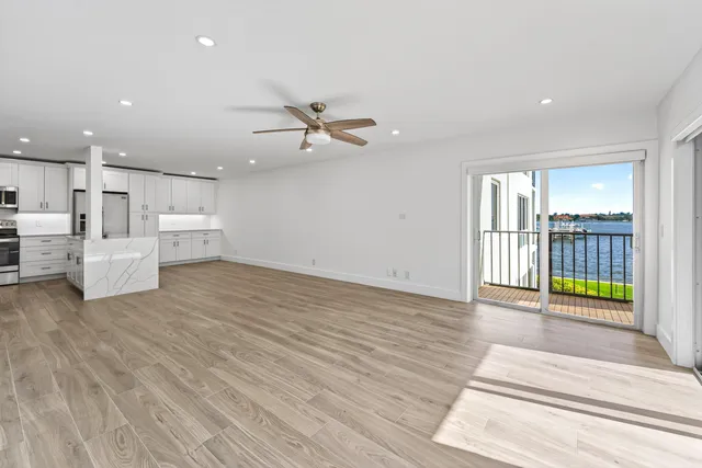 a view of a room with window and wooden floor