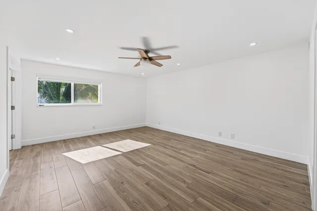 a bathroom with a double vanity sink toilet mirror and shower