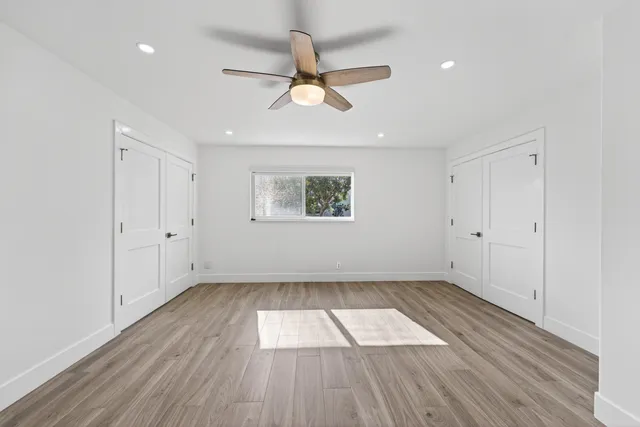 a view of a balcony with wooden floor