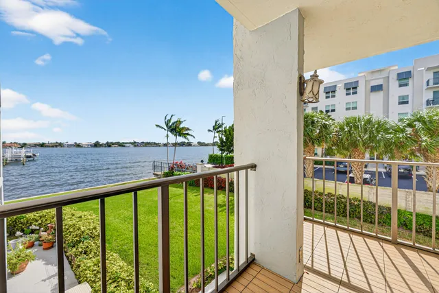 a terrace with outdoor seating and city view