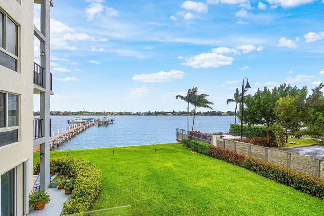 a kitchen with stainless steel appliances a refrigerator sink and cabinets