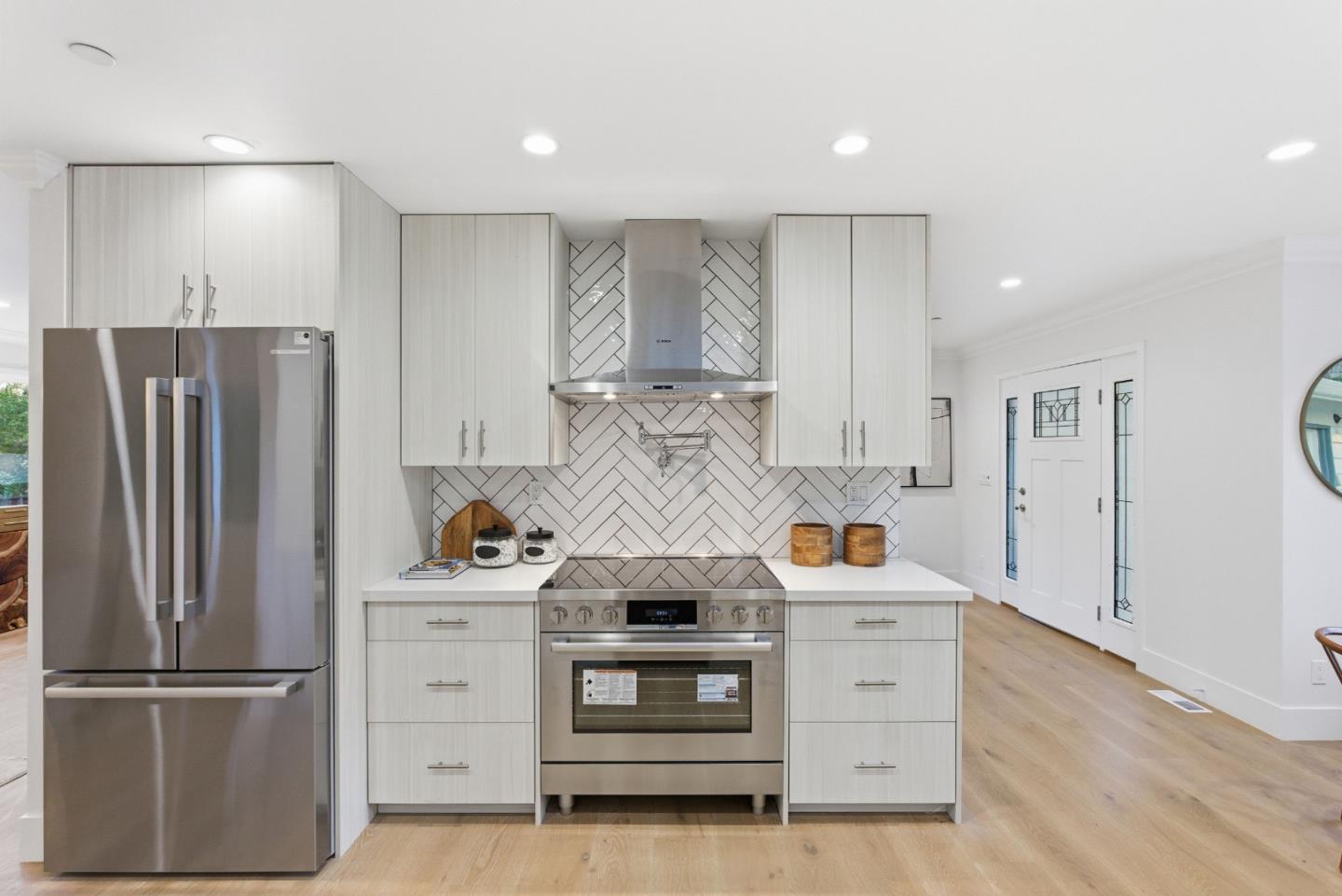 670 La Mesa Drive Portola Valley, CA 94028 - Photo 16 of 43 a kitchen with stainless steel appliances a stove and a refrigerator