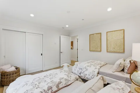 a bedroom with a bed and with furniture