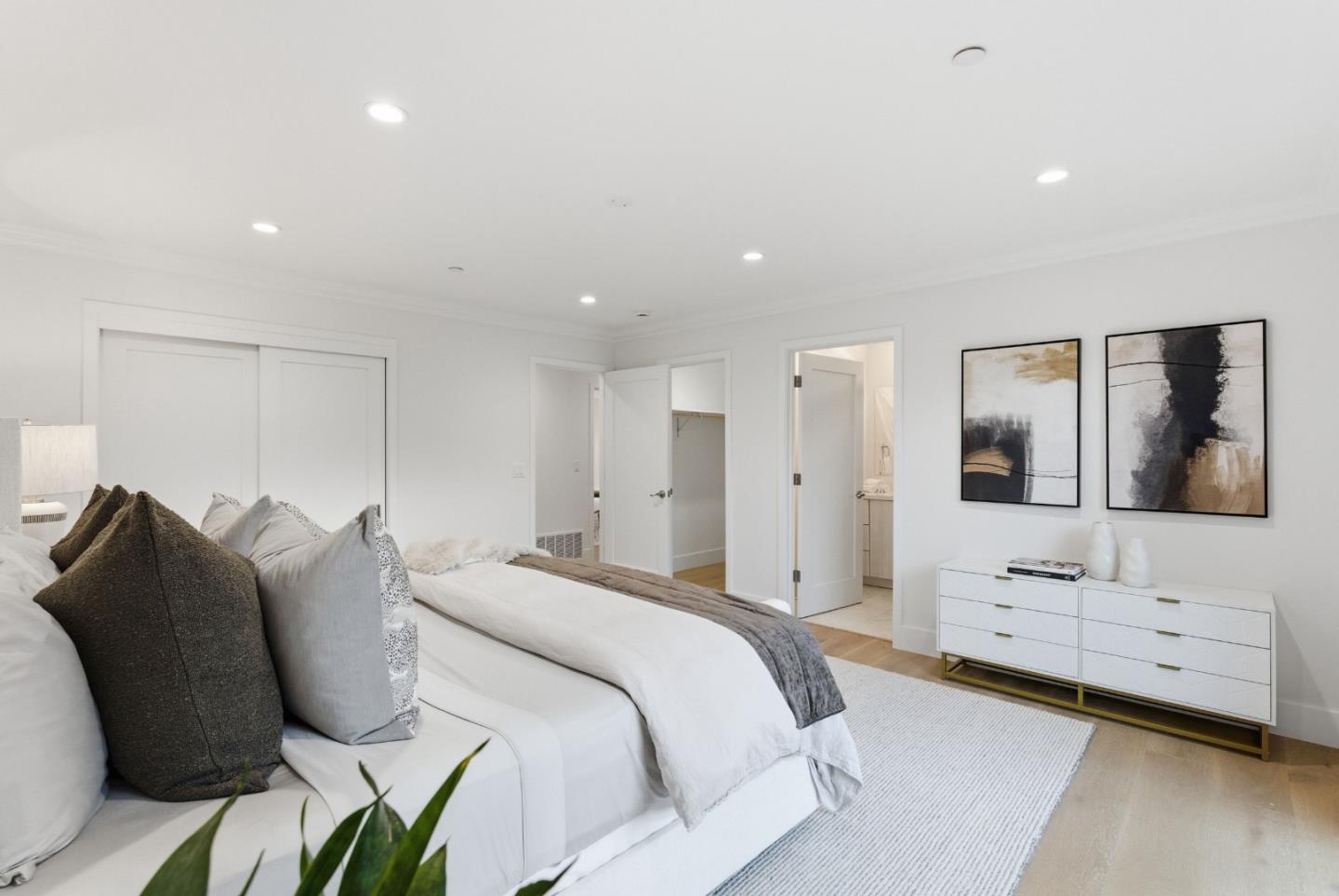 670 La Mesa Drive Portola Valley, CA 94028 - Photo 23 of 43 a spacious bedroom with a bed and a flat screen tv