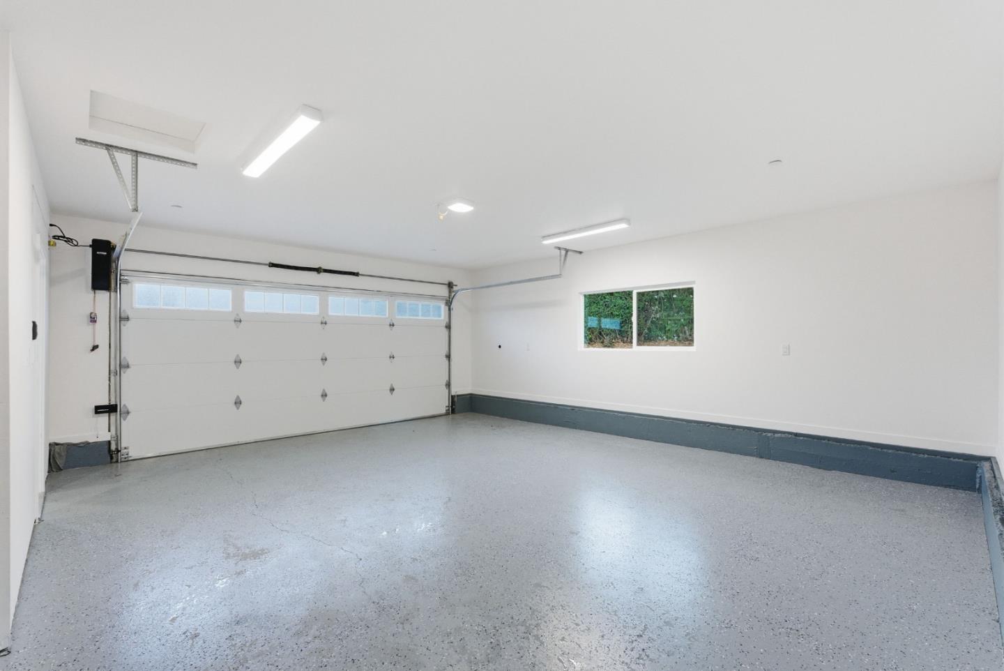 670 La Mesa Drive Portola Valley, CA 94028 - Photo 29 of 43 an empty room with a empty space and windows