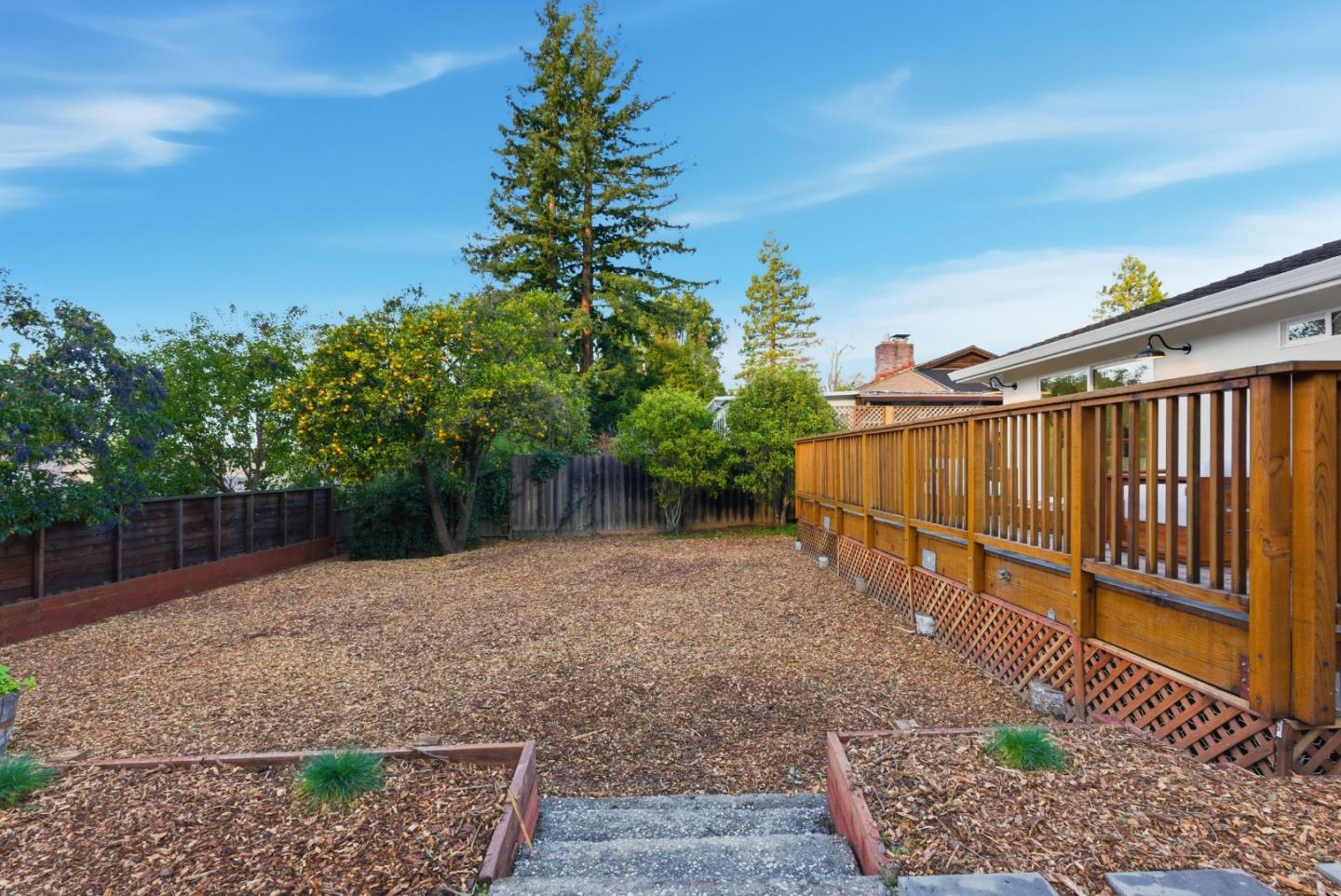 670 La Mesa Drive Portola Valley, CA 94028 - Photo 36 of 43 a view of a backyard with plants and wooden fence