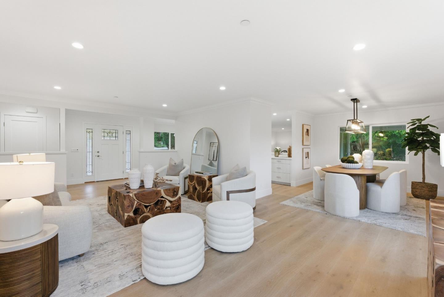 670 La Mesa Drive Portola Valley, CA 94028 - Photo 8 of 43 a living room with couches and kitchen view with wooden floor