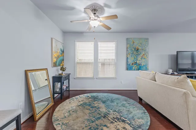 a living room with furniture and a table