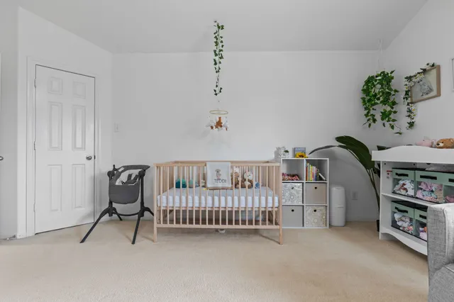 a view of a room with furniture and toys