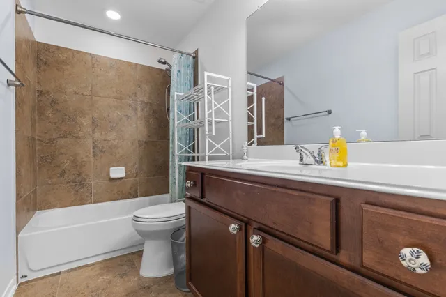 a bathroom with a sink a toilet and a bathtub