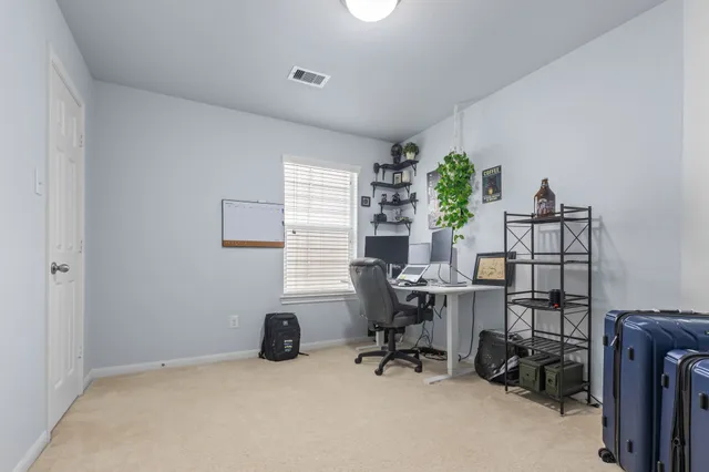 a workspace with furniture and a window