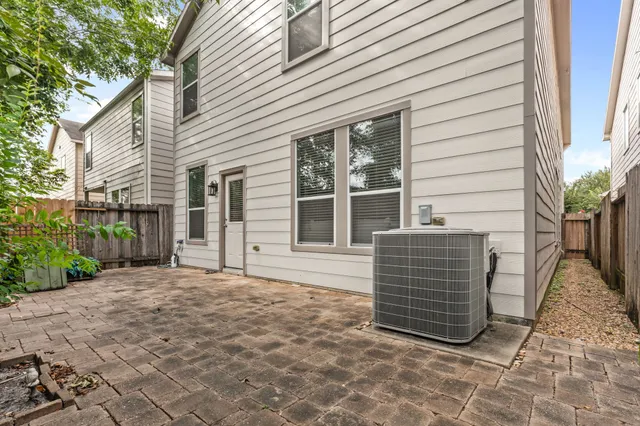a view of house with backyard and garden