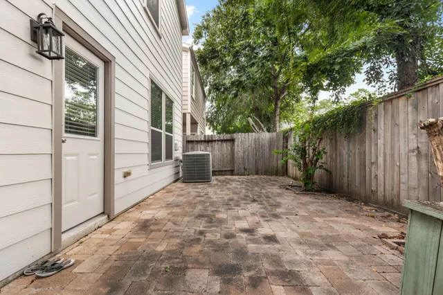 a view of backyard with tub and trees