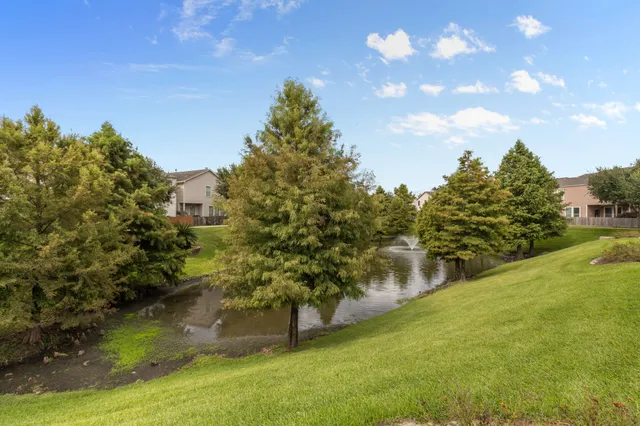 a view of a lake in front of the house