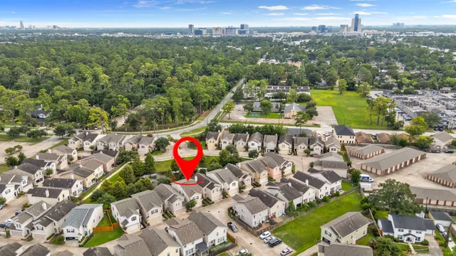an aerial view of residential houses with outdoor space and street view
