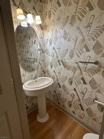 a bathroom with a sink and mirror