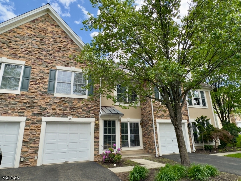 35 Magnolia Way, Unit 35 North Haledon, NJ 07508 - Photo 2 of 34 a front view of a house with a yard