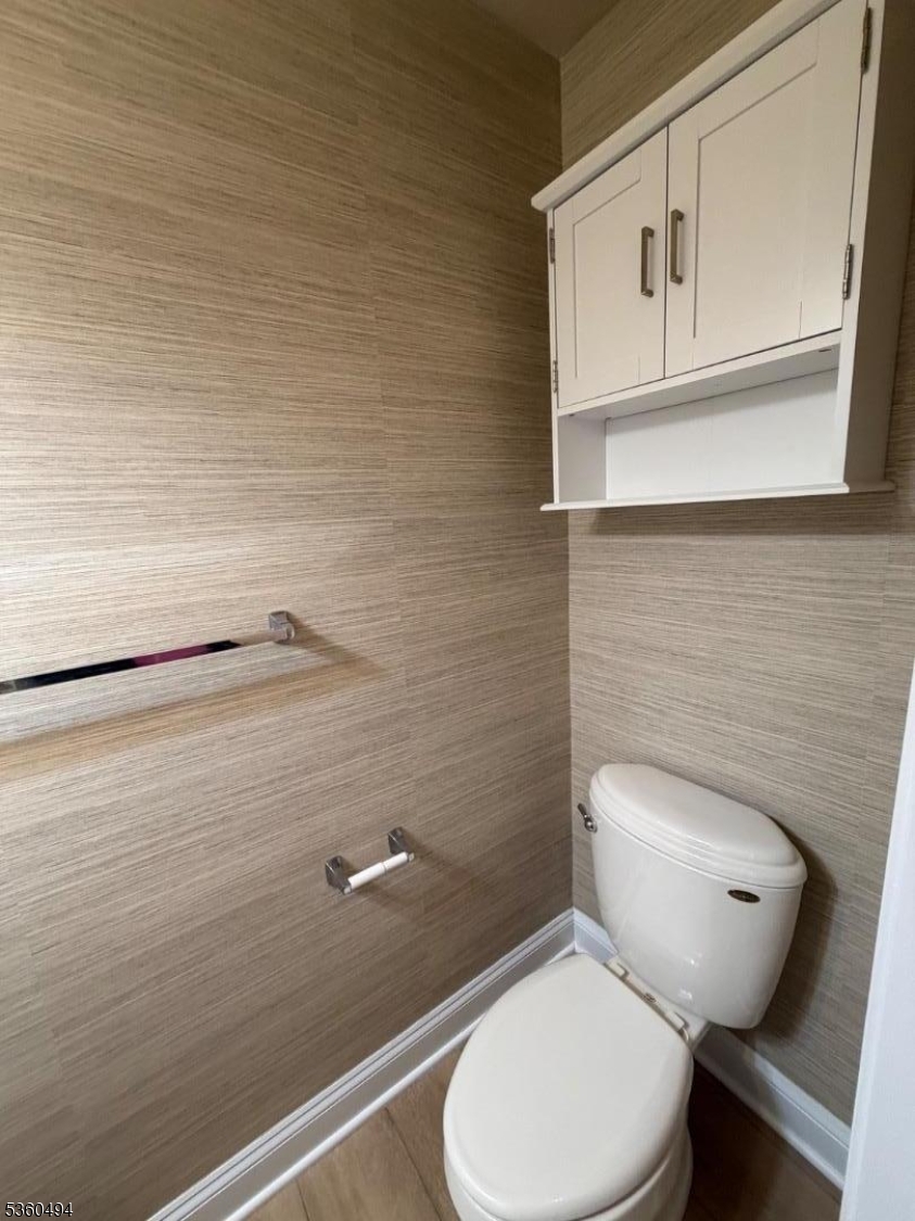 35 Magnolia Way, Unit 35 North Haledon, NJ 07508 - Photo 22 of 34 a toilet sitting in a bathroom next to a sink