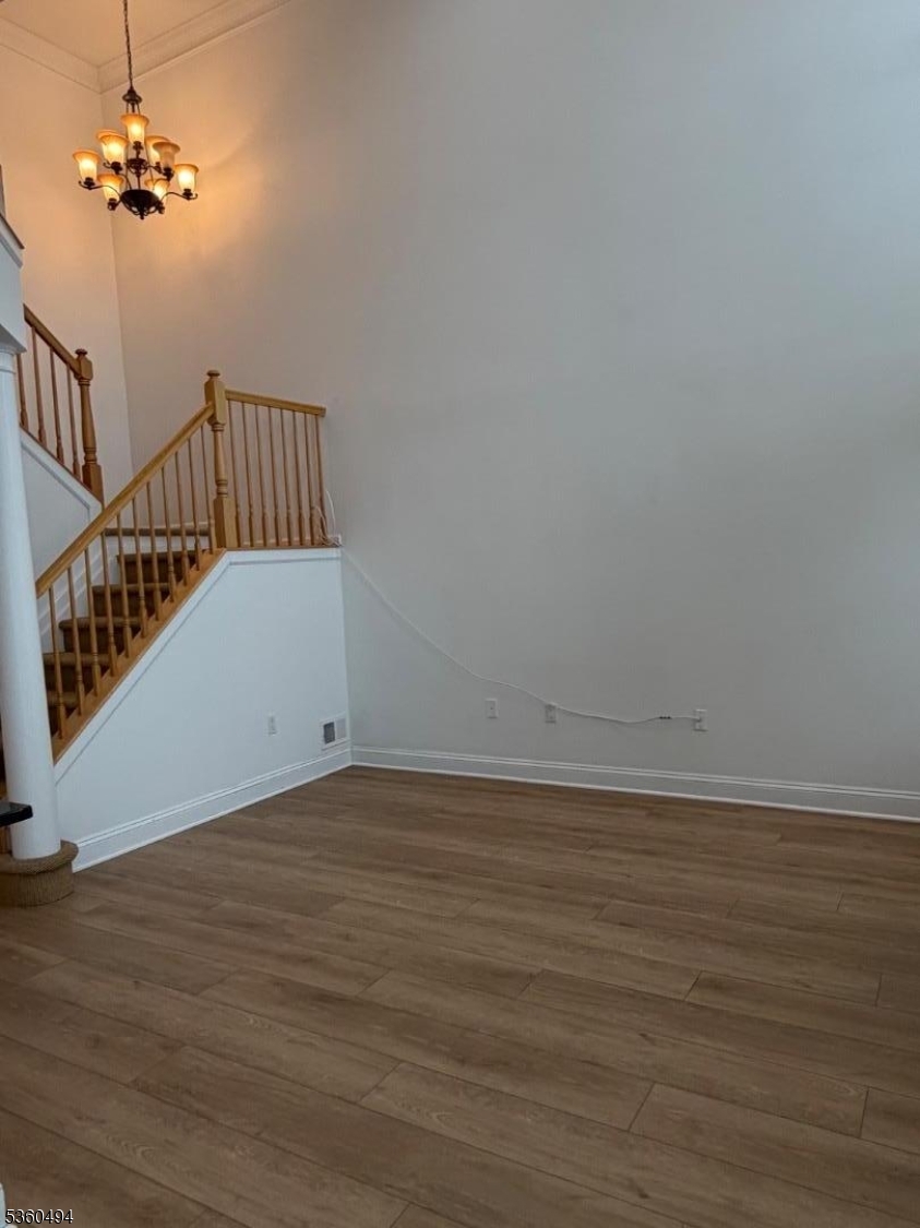 35 Magnolia Way, Unit 35 North Haledon, NJ 07508 - Photo 23 of 34 a view of an empty room with wooden floor