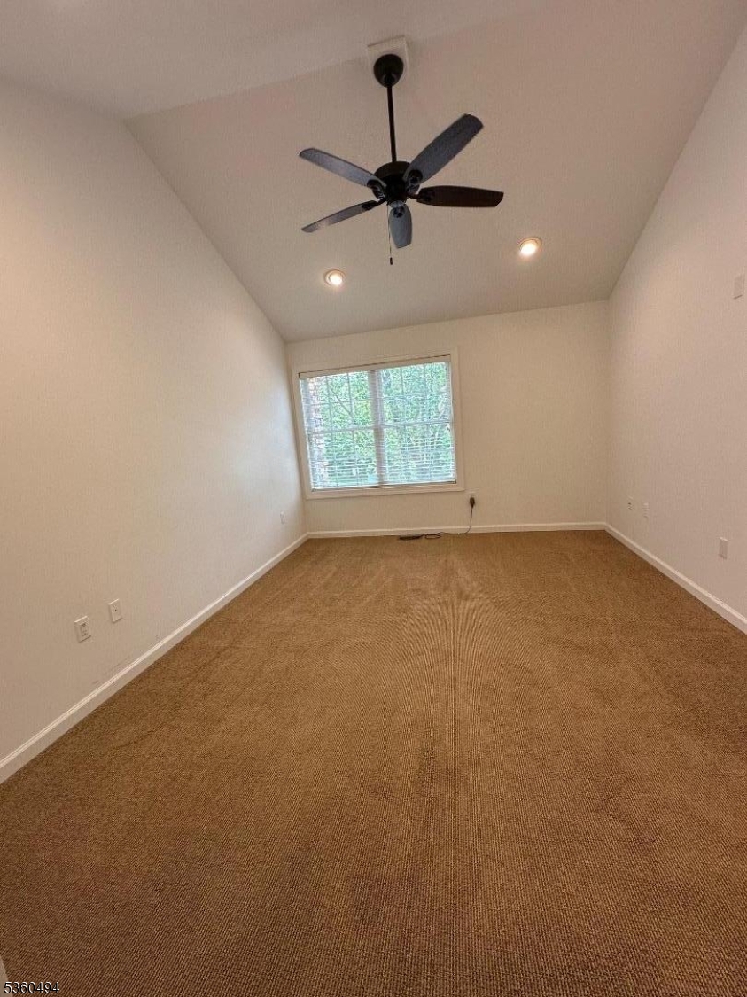 35 Magnolia Way, Unit 35 North Haledon, NJ 07508 - Photo 25 of 34 an empty room with a window and a fan