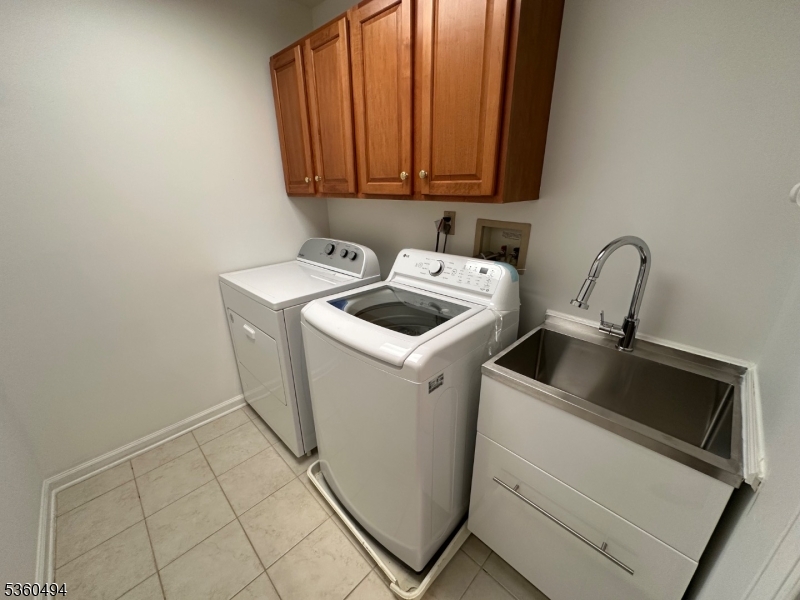 35 Magnolia Way, Unit 35 North Haledon, NJ 07508 - Photo 34 of 34 a view of storage and utility room with washer and dryer