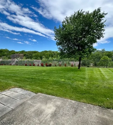 a view of a green field with clear sky