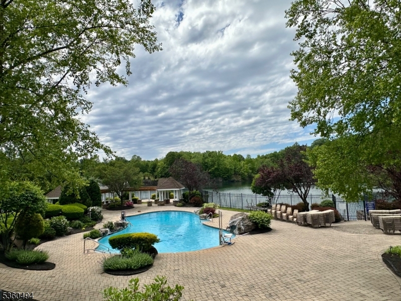 35 Magnolia Way, Unit 35 North Haledon, NJ 07508 - Photo 4 of 34 a view of a swimming pool with couches and lounge chairs