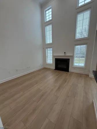 a kitchen with granite countertop wooden cabinets and a stove top oven