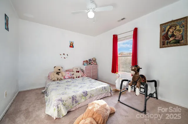 a bedroom with a bed and a table