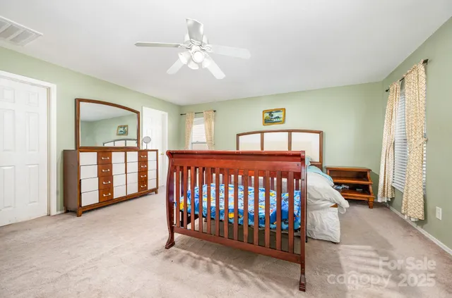 a bedroom with furniture and window