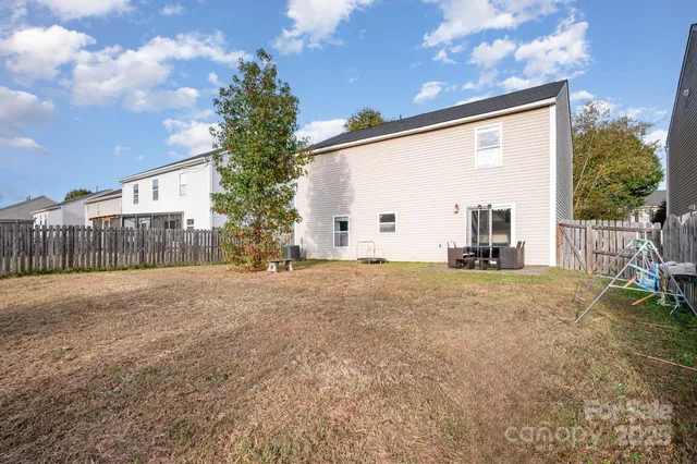 a view of a back yard of the house
