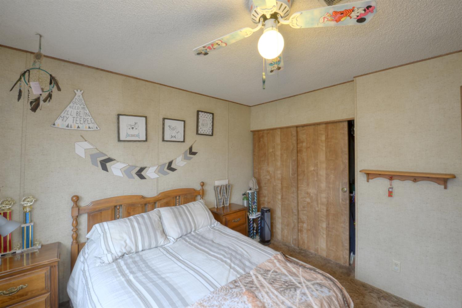 1471 Highway 33 Gustine, CA 95322 - Photo 54 of 57 a bedroom with a bed and a chandelier