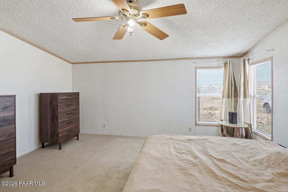 24725 North Patricia Road Paulden, AZ 86334 - Photo 11 of 30 a view of room with hardwood floor and ceiling fan