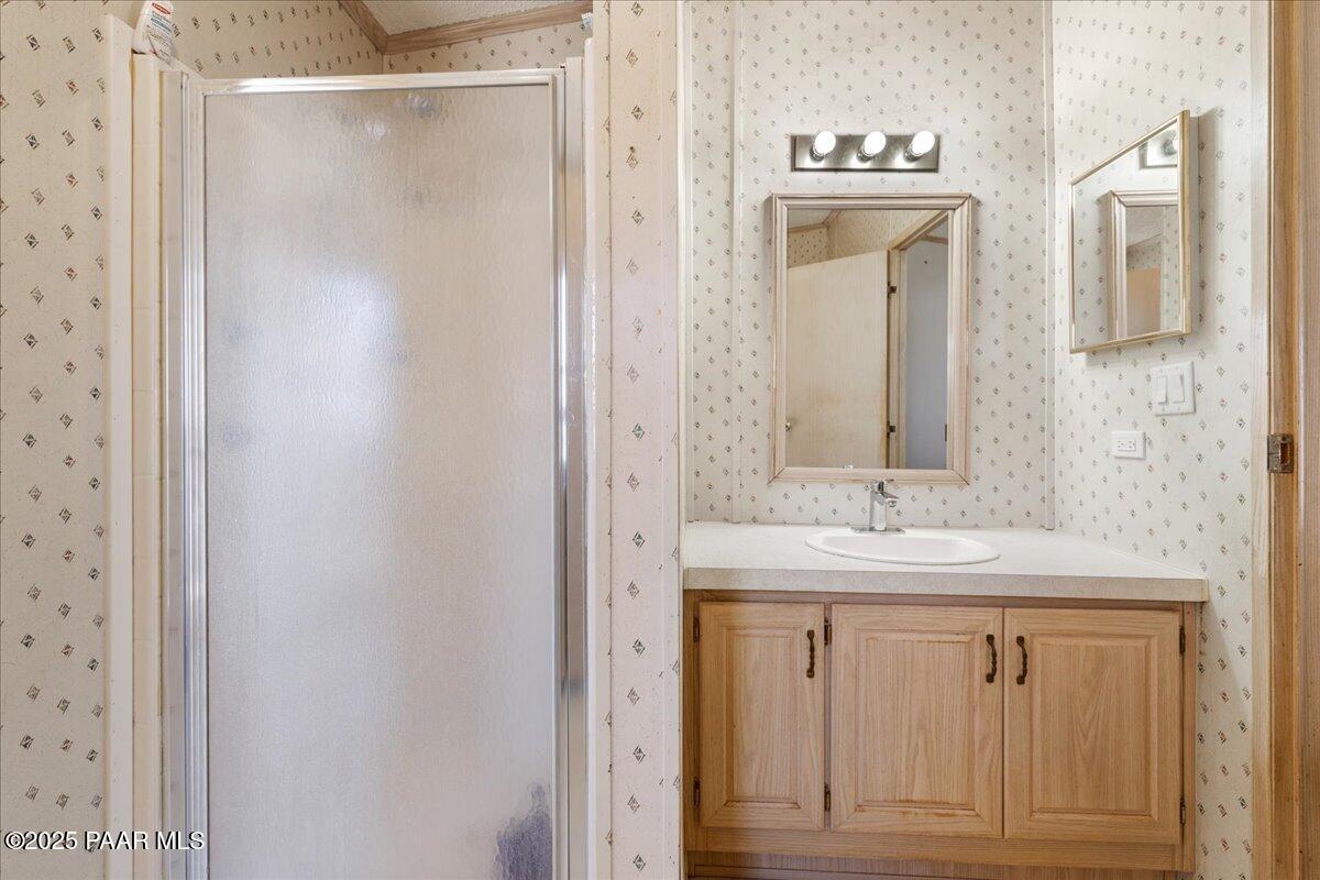 24725 North Patricia Road Paulden, AZ 86334 - Photo 20 of 36 a bathroom with a sink and a mirror