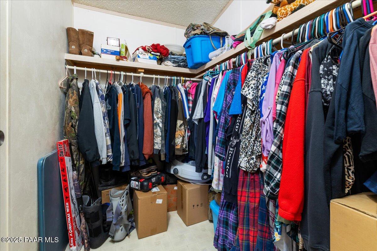24725 North Patricia Road Paulden, AZ 86334 - Photo 22 of 36 a view of walk in closet with clothes