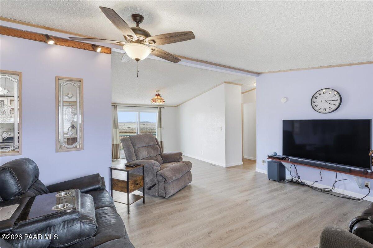 24725 North Patricia Road Paulden, AZ 86334 - Photo 5 of 30 a living room with furniture and a flat screen tv