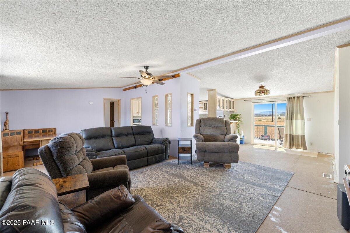 24725 North Patricia Road Paulden, AZ 86334 - Photo 7 of 36 a living room with furniture and a large window
