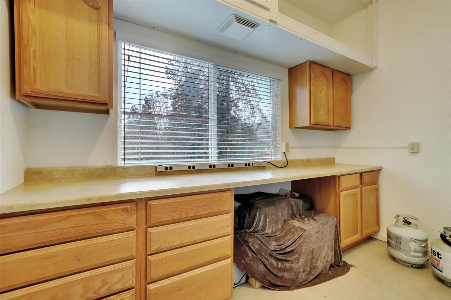 17036 Alice Way Grass Valley, CA 95949 - Photo 43 of 58 a kitchen with a sink and a window