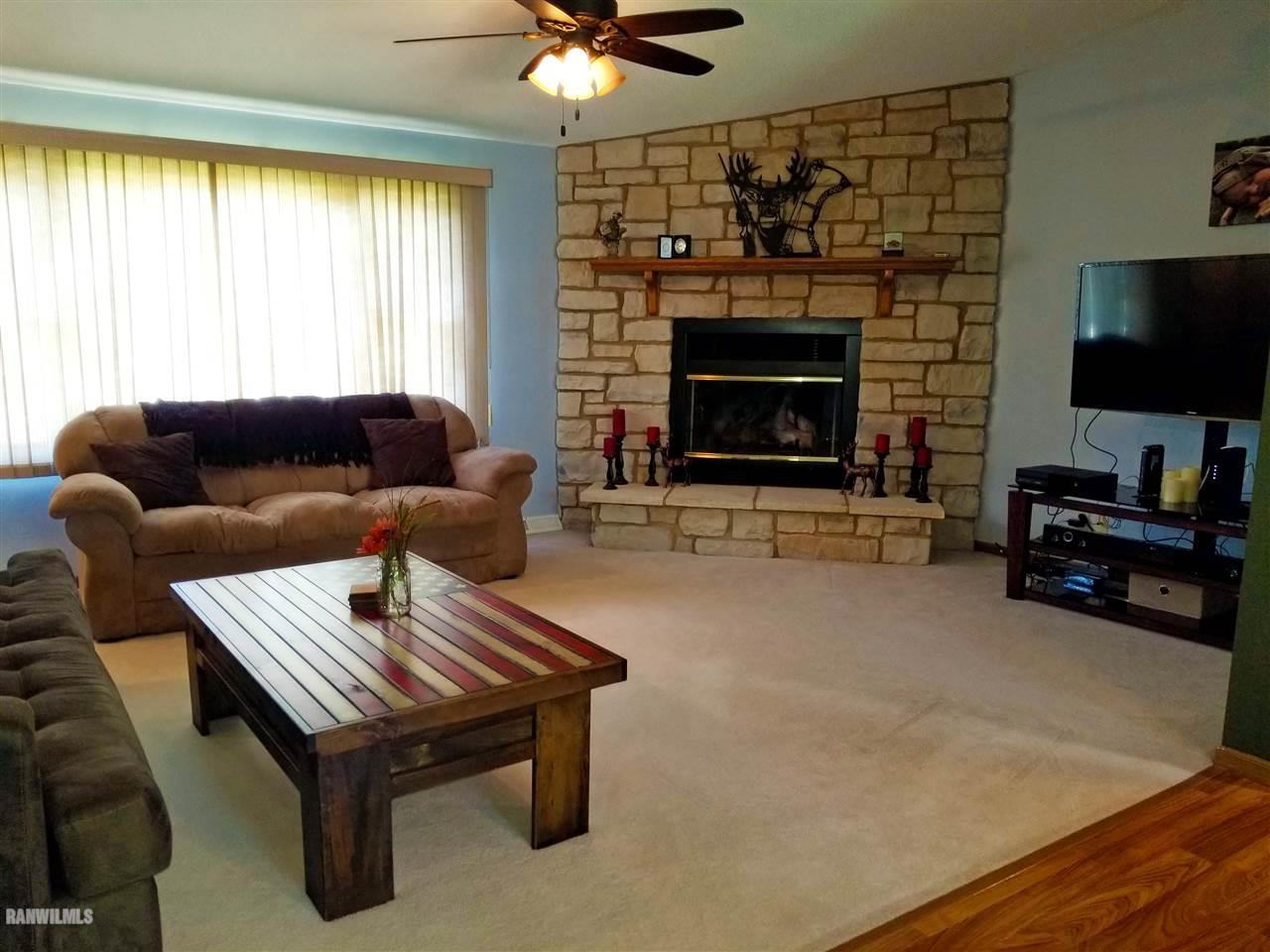202 West Division Road Shannon, IL 61078 - Photo 14 of 14 a living room with furniture and a fireplace