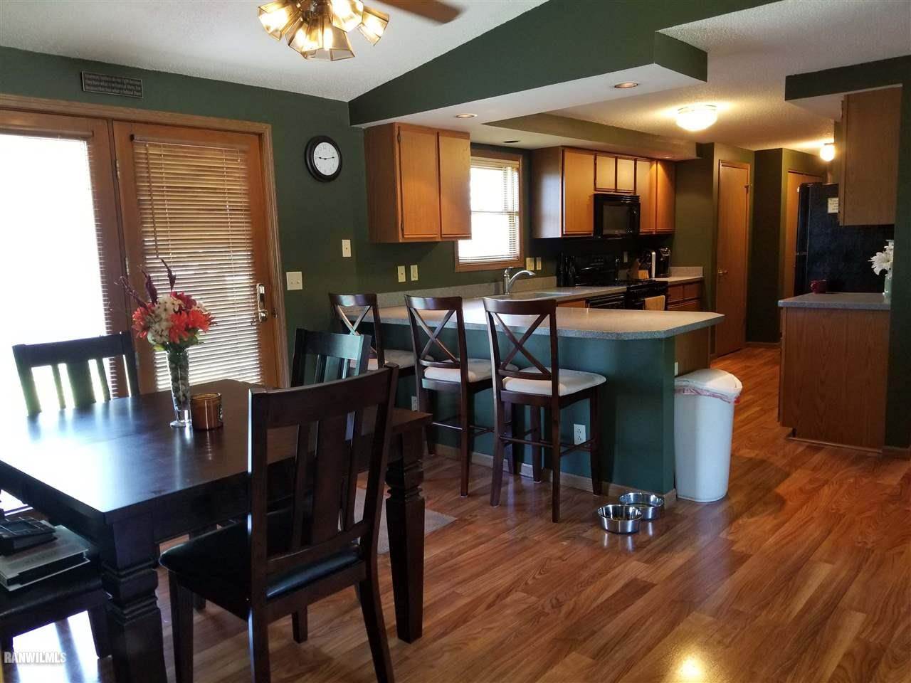 202 West Division Road Shannon, IL 61078 - Photo 2 of 14 a view of a dining room with furniture and wooden floor