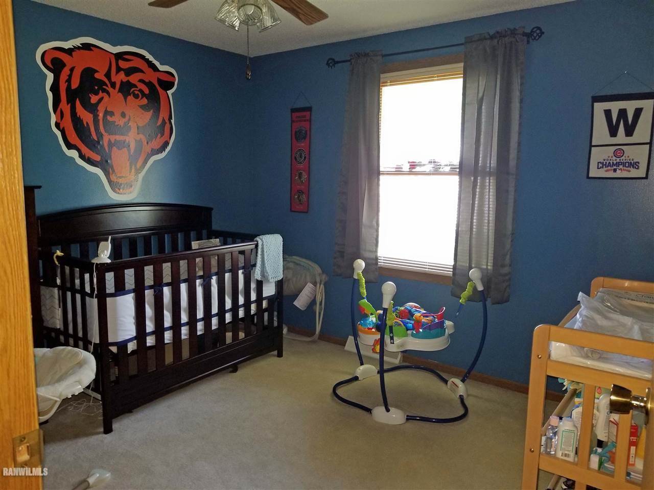202 West Division Road Shannon, IL 61078 - Photo 4 of 14 a bedroom with furniture and window