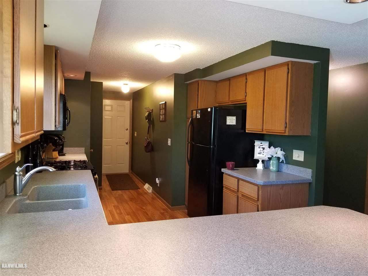 202 West Division Road Shannon, IL 61078 - Photo 8 of 14 a bathroom with a sink and a mirror