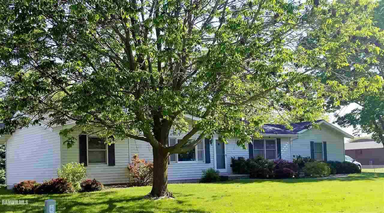 202 West Division Road Shannon, IL 61078 - Photo 10 of 14 a front view of a house with garden