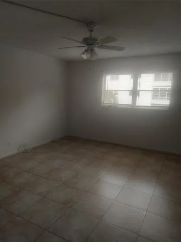 a white toilet sitting next to a shower