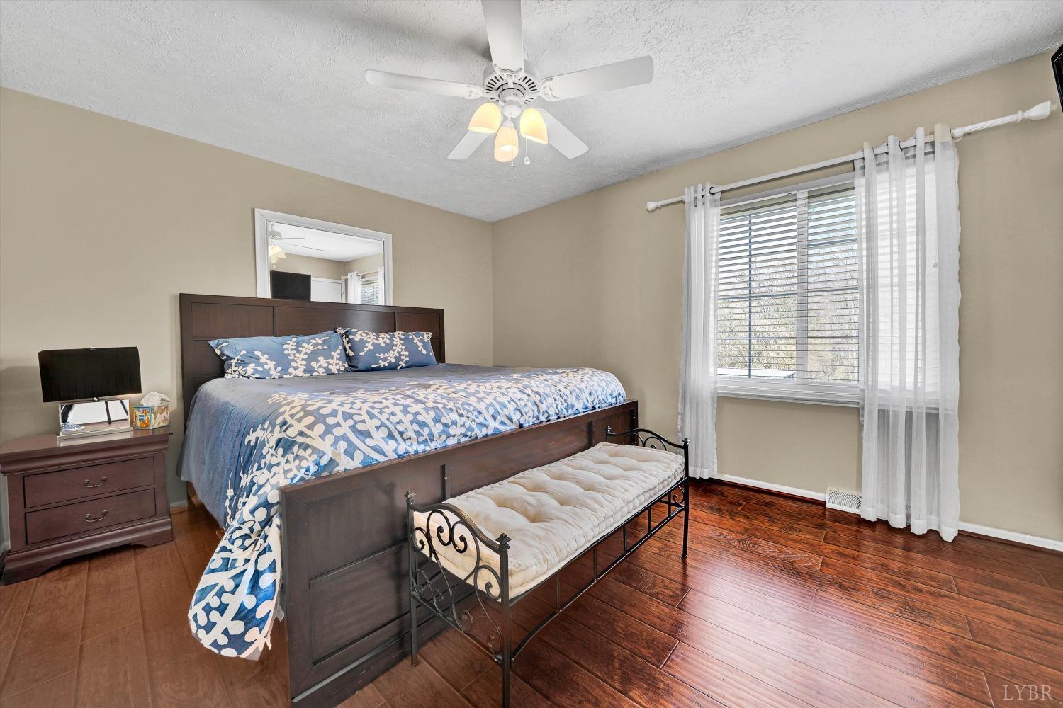 505 Sweeney Circle Forest, VA 24551 - Photo 12 of 29 a bedroom with a bed and a table