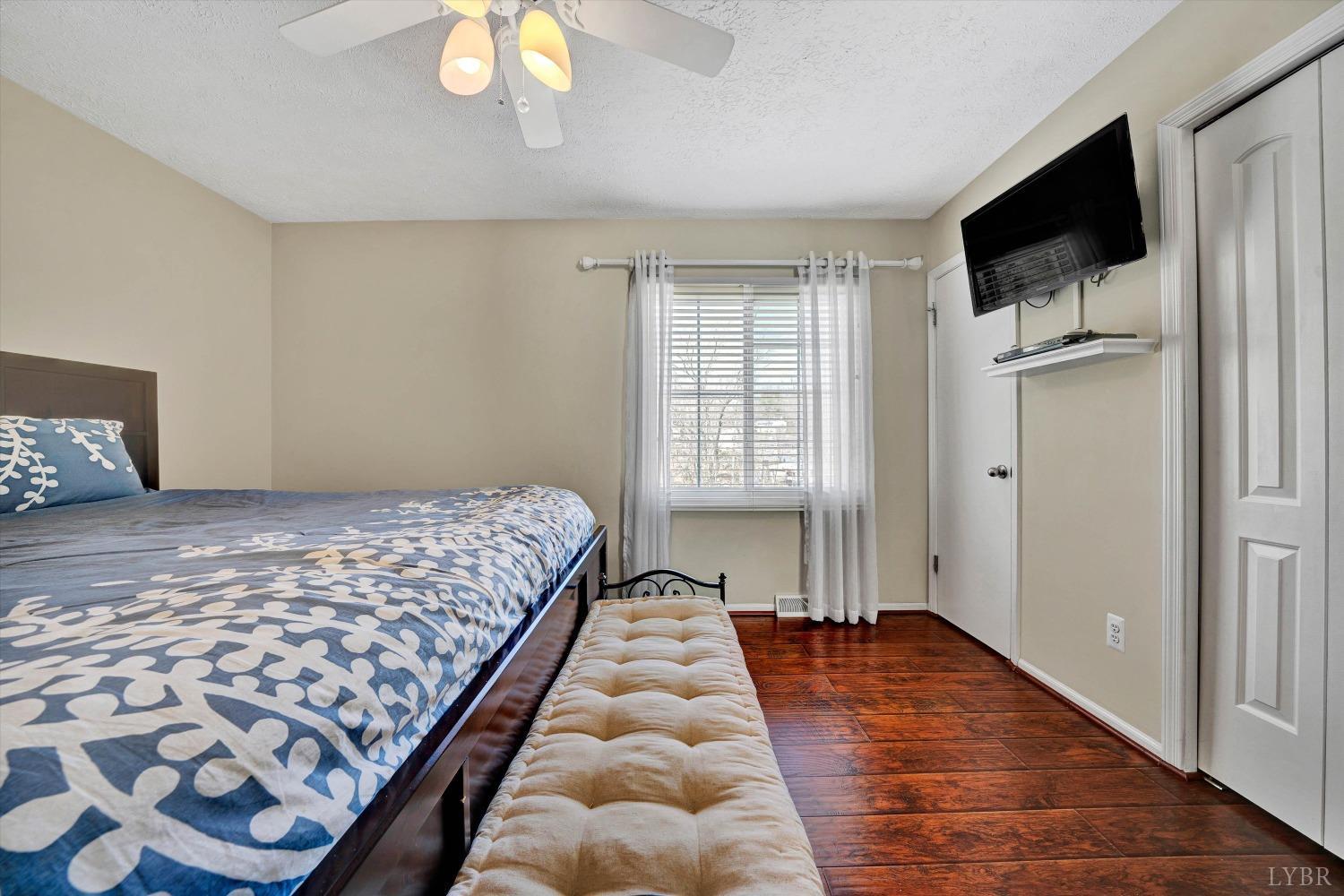 505 Sweeney Circle Forest, VA 24551 - Photo 13 of 29 a bedroom with a bed and a flat screen tv