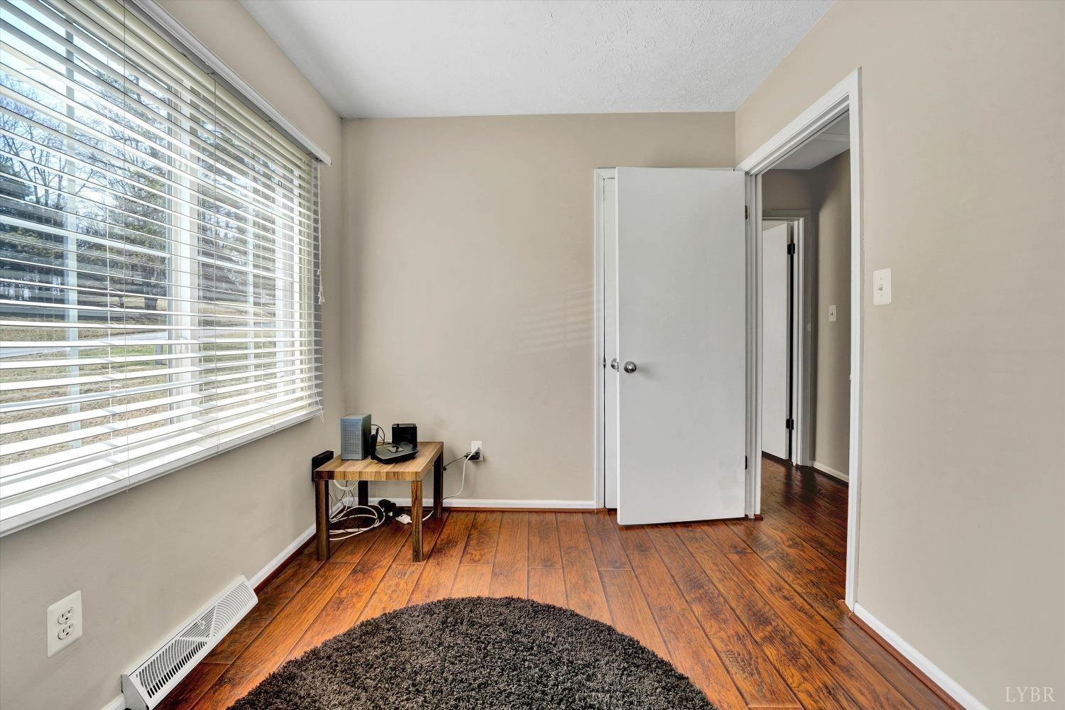 505 Sweeney Circle Forest, VA 24551 - Photo 16 of 29 a room with wooden floor and a window