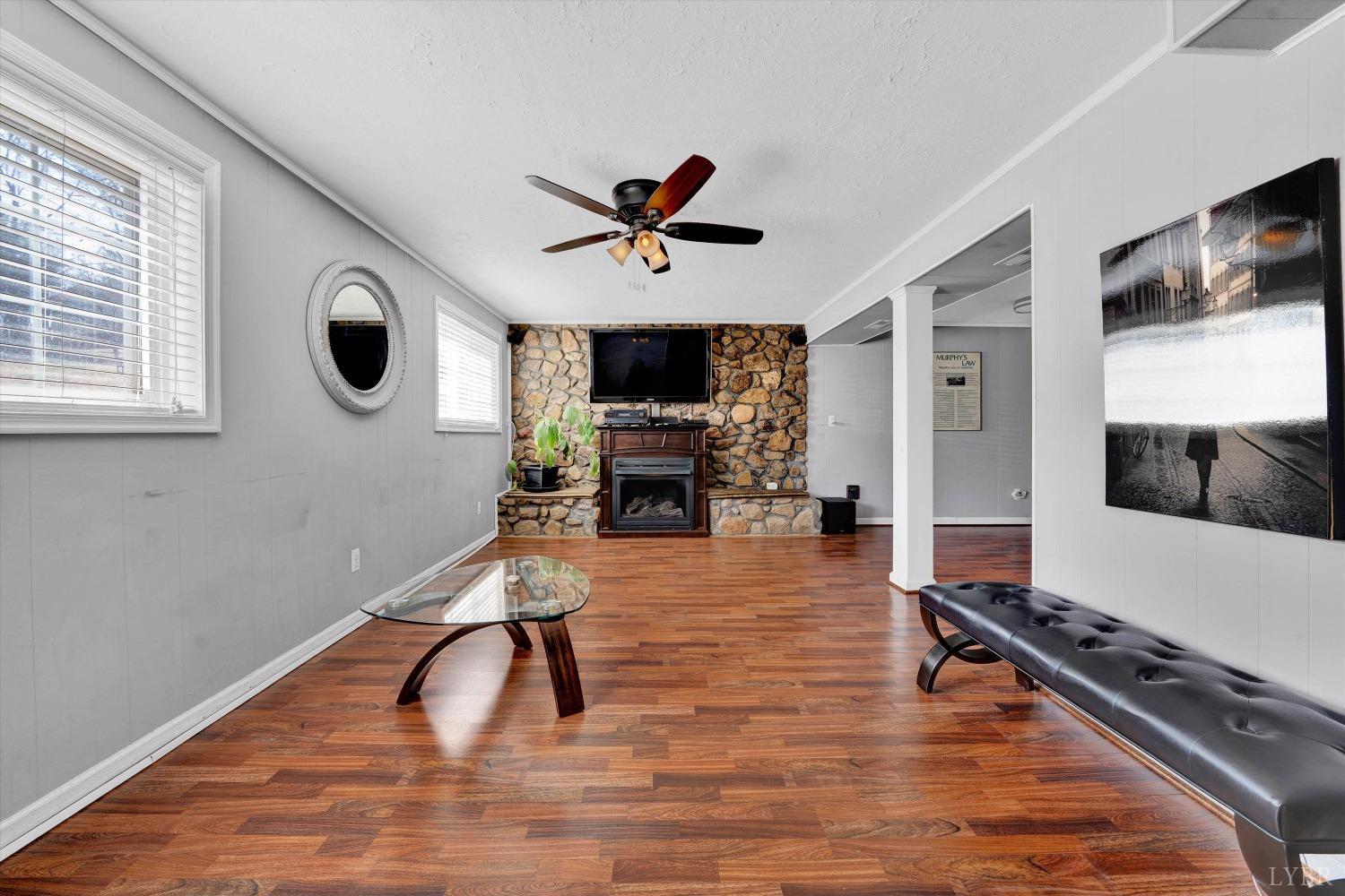 505 Sweeney Circle Forest, VA 24551 - Photo 18 of 29 a living room with furniture flat screen tv and a fireplace