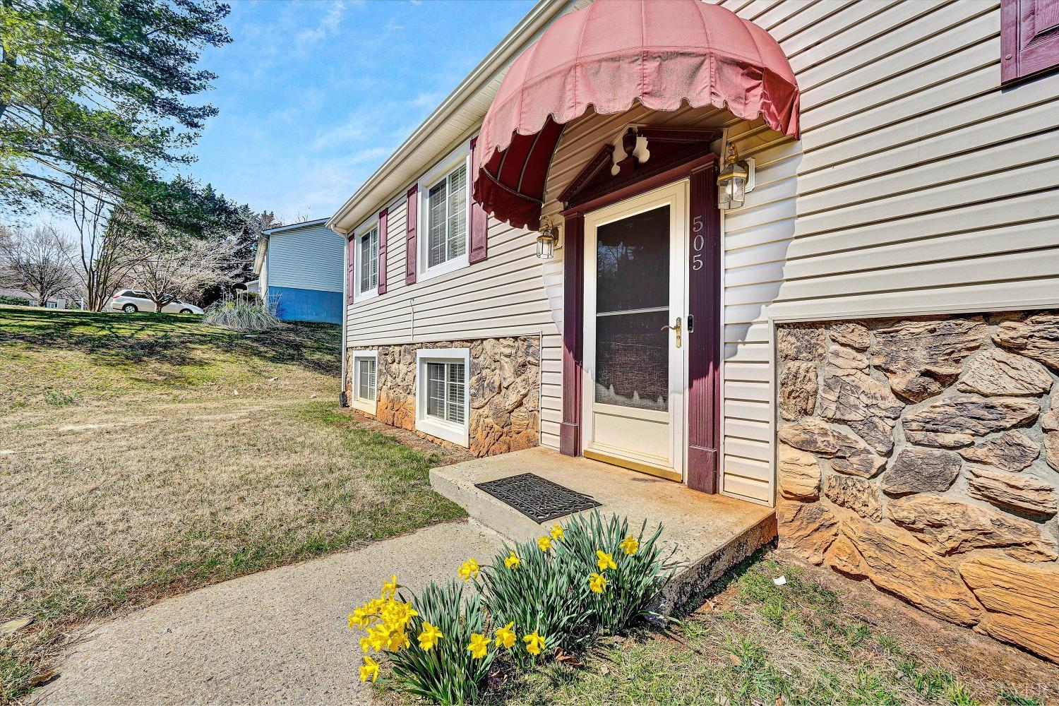 505 Sweeney Circle Forest, VA 24551 - Photo 3 of 29 a view of a house with a small yard and a large tree